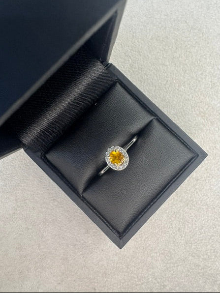 Platinum Oval Cut Yellow Sapphire and Diamond Ring